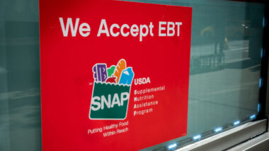 A sign in the window of a 7-Eleven in New York announces that the convenience store accept SNAP (Supplemental Nutrition Assistance Program) formerly known as EBT
