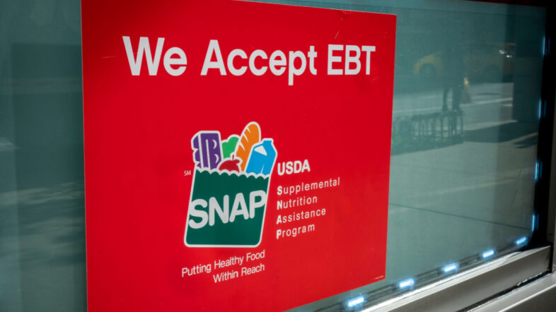 A sign in the window of a 7-Eleven in New York announces that the convenience store accept SNAP (Supplemental Nutrition Assistance Program) formerly known as EBT